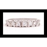 A hallmarked 9ct white gold and CZ seven stone ring having seven prong set CZ. Weight 3.2g. Size N.