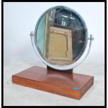 A 1930's Art Deco chrome dressing mirror. The chrome framed roundel mirror set over chrome arched