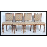 A set of four early 20th century Edwardian dining chairs raised on turned and splayed legs with