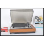A vintage 20th century Lenco Goldring GL75 stereo transcription turntable, teak case with smoked