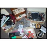 A very large collection of costume jewellery held within four jewellery boxes to include rings ,