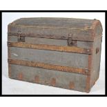 A Victorian wooden bound dome top steamer trunk chest having a dome top with clasps to front