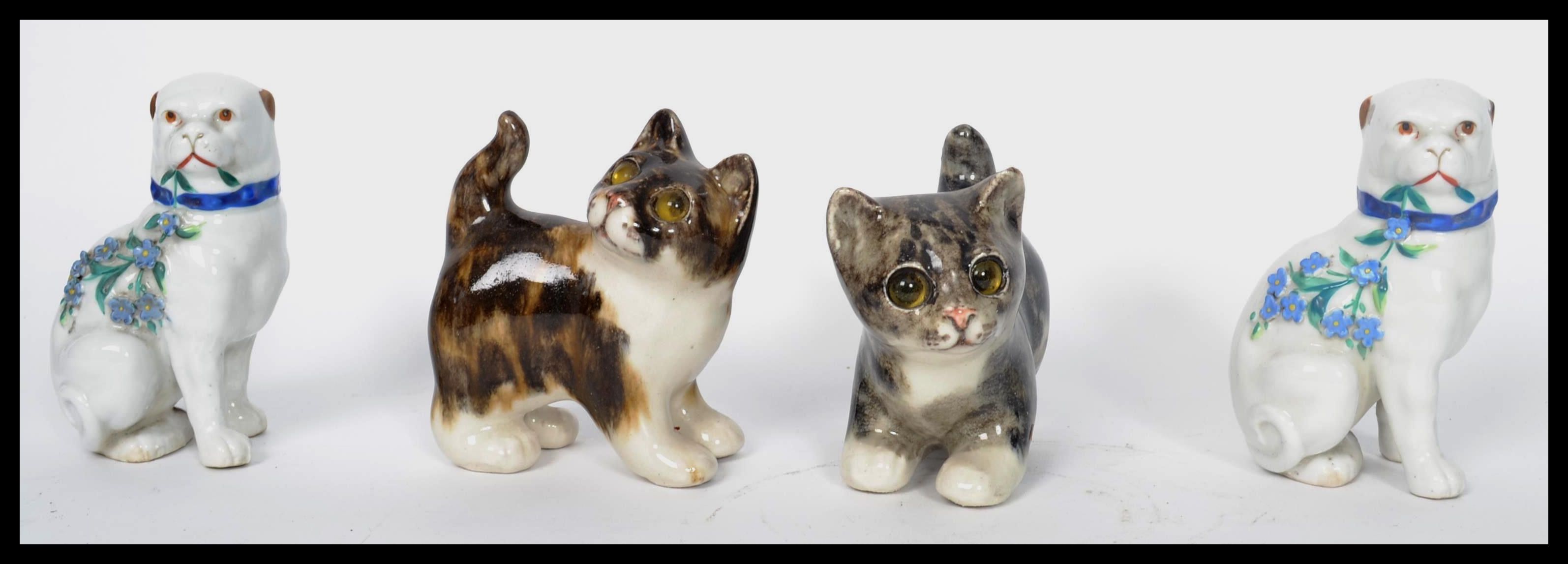 A pair of Winstanley ceramic tabby kittens - cats, each with glass eyes and signed to the base