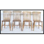 A good set of 4 19th century Victorian beech and elm windsor dining chairs raised on turned legs