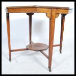 An early 20th century Edwardian mahogany octagonal centre table, cabriole supports connected by