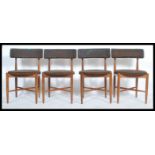 A set of 4 retro 1970's G-Plan teak wood dining chairs in the manner of Kofod Larsen. Raised on