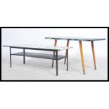 Two retro vintage 20th century  1960's coffee tables both raised on tapering legs with brightly