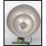 A vintage mid century aluminium clip on factory workers pendant lamp having a half moon shade with
