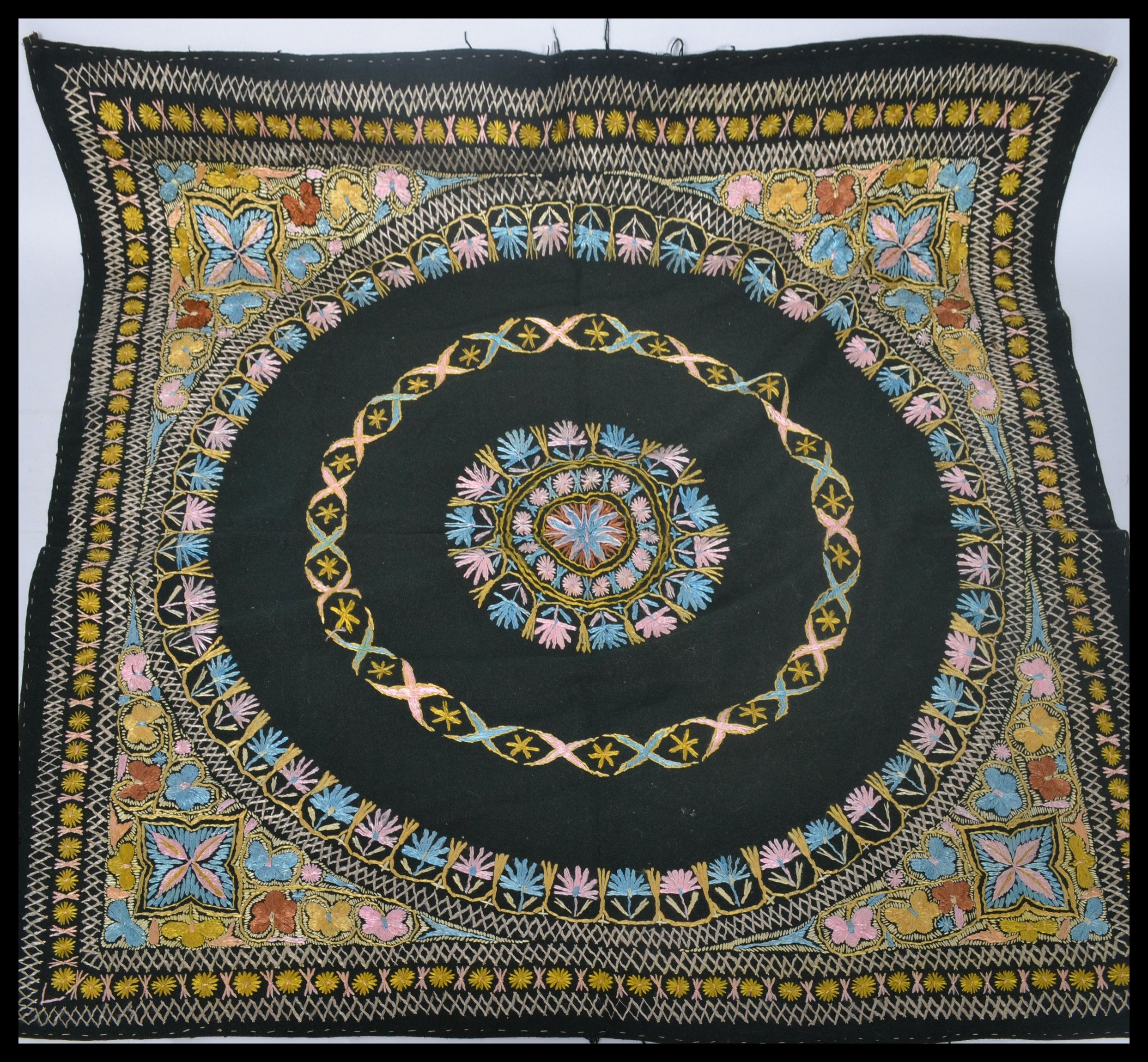 An early 20th century Indian wall hanging having a cotton back with silk threads. The design of