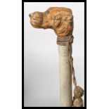 An early 20th century promenade cane with hunting interest having a white painted bamboo cane and