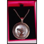 A silver Essex crystal necklace pendant depicting a horse on a silver chain. Complete in