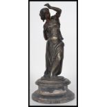 A 19th century spelter figurine statue of a maiden. The patternated metal statue raised on an