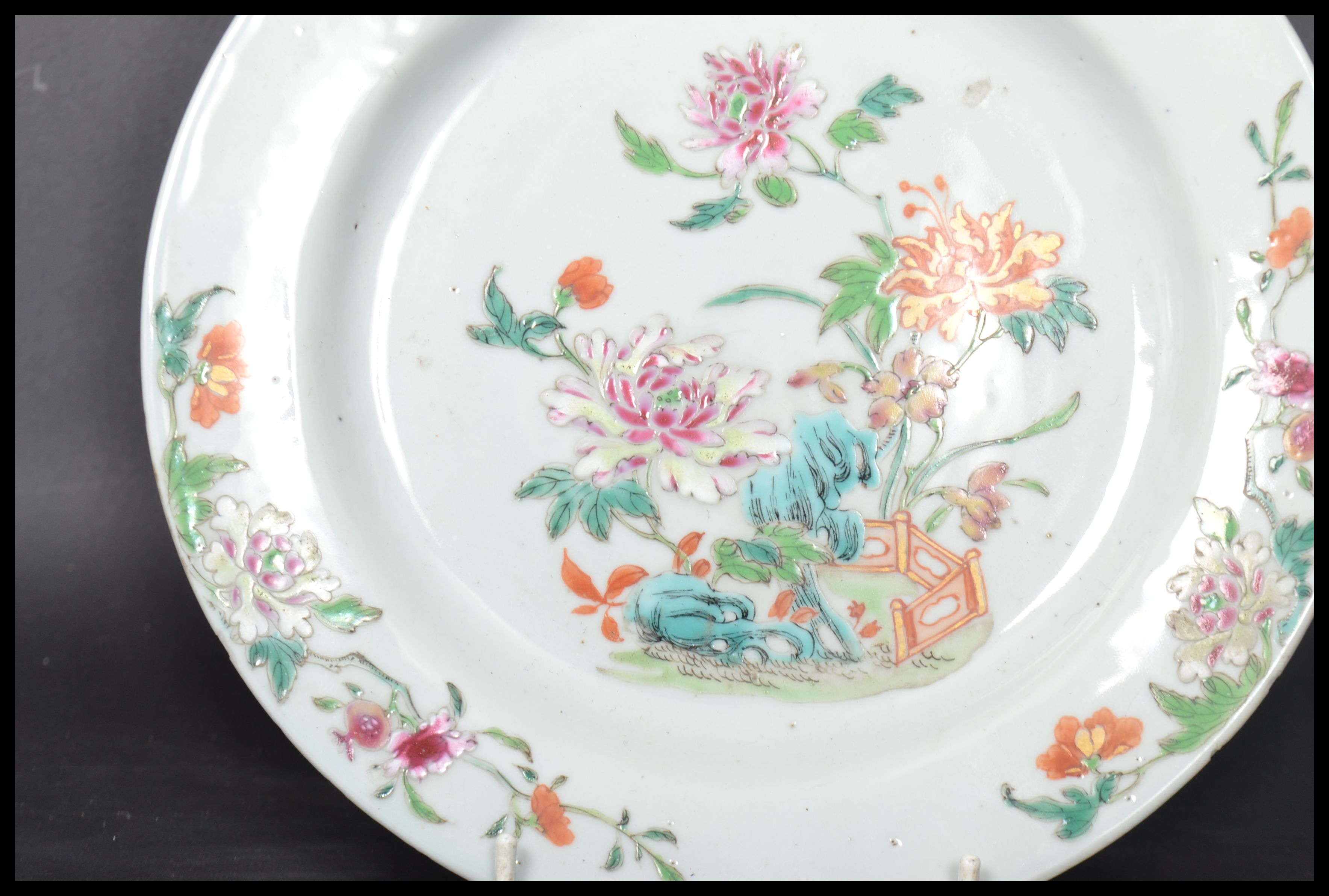 An 18th century Chinese Qing Long Famille Rose plate hand painted with enamels depicting floral - Image 5 of 8