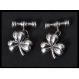 A pair of sterling silver lucky clover gentlemen's cuff links. Weighs 10.1 grams.
