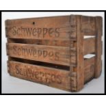 A retro mid century Industrial wooden crate with original notation to the sides for Schweppes.