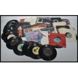 Vinyl records A collection of 45rpm vinyl 7" record singles from the 1970s and 1980s featuring