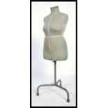 A vintage retro mid 20th century Dress makers haberdashery dummy by Singer raised on an adjustable
