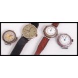 A group of four silver cocktail watches. One having enamel decoration and two set to vintage leather