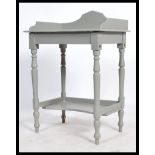 A 20th century antique style painted shabby chic console table. Raised on turned supports with