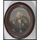 An early 19th century mahogany framed oval portrait miniature print of Admiral Nelson in naval