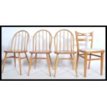 A set of three 1960's ercol light elm and beech wood hoop back dining chairs together with a mid