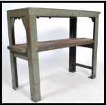 A stunning vintage 20th century industrial metal factory worktop / bench / side table raised on a