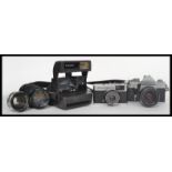 A collection of vintage 35mm cameras and lenses to include Praiktica, Olympus, please refer to