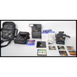 A vintage collectable 20th century Polaroid SLR 680 camera with 3 packs of films together with a