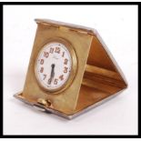 An early 20th century silver hallmarked folding travelling desk clock by Cohen & Charles being
