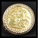 A vintage 20th century half sovereign ring having a 1982 Elizabeth 2nd half sovereign coin set