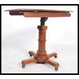 A 19th century Victorian adjustable double sided mahogany reading table lecturn by John Carter of