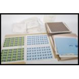 A collection of commemorative stamps and decimal books of stamps, sheets of stamps commemorating