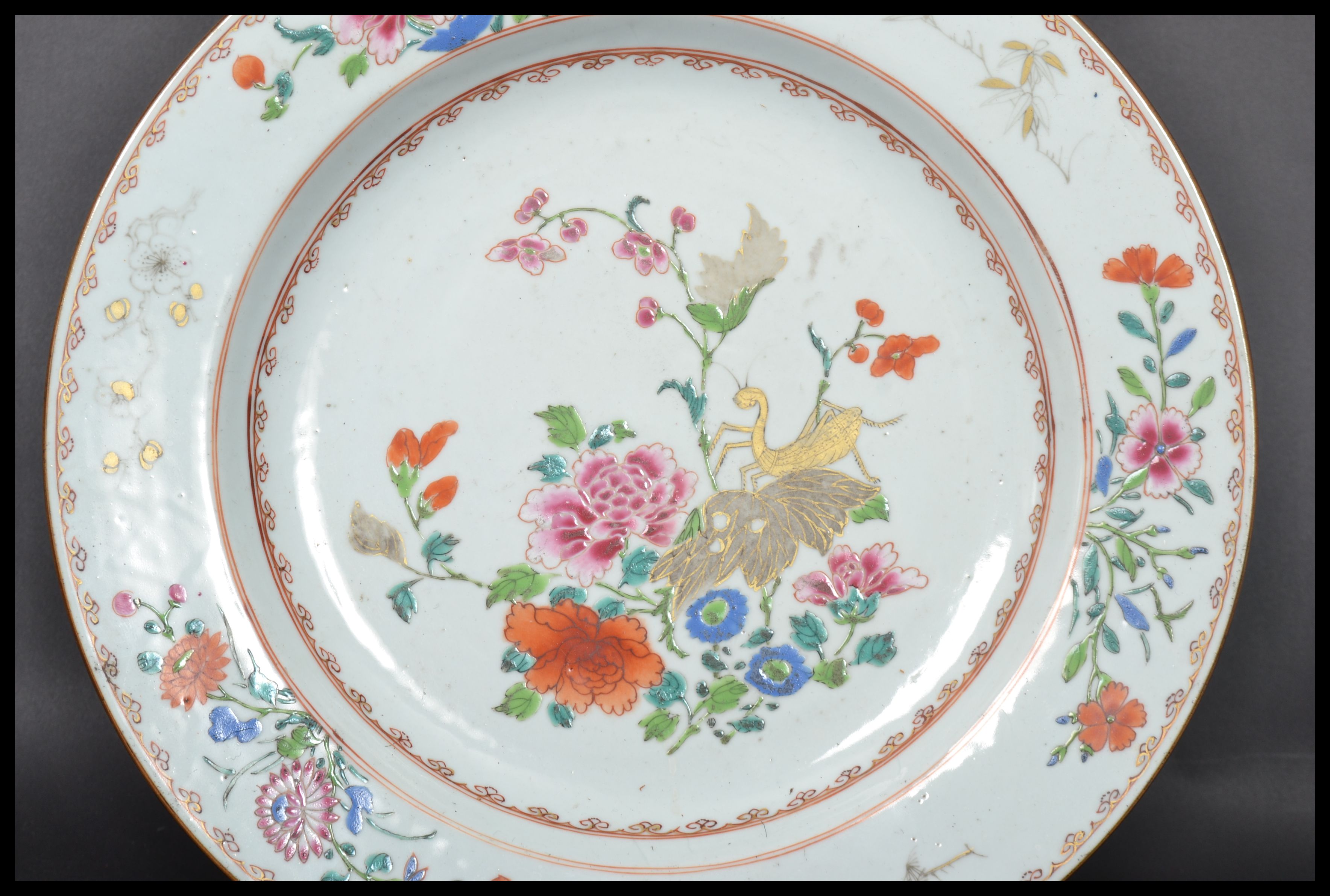 An 18th century Chinese Qing Long Famille Rose plate hand painted with enamels depicting floral - Image 5 of 8