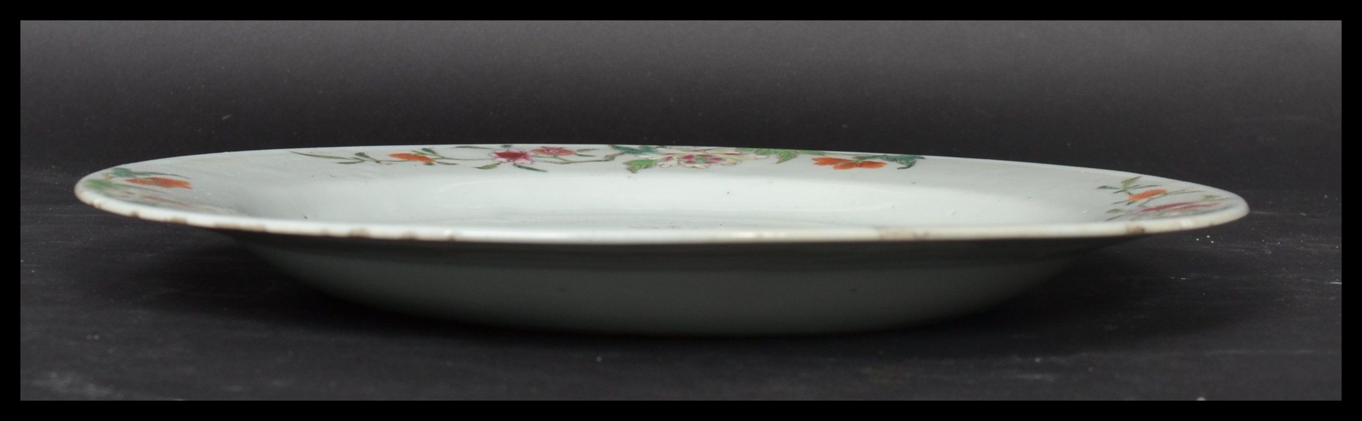 An 18th century Chinese Qing Long Famille Rose plate hand painted with enamels depicting floral - Image 7 of 8