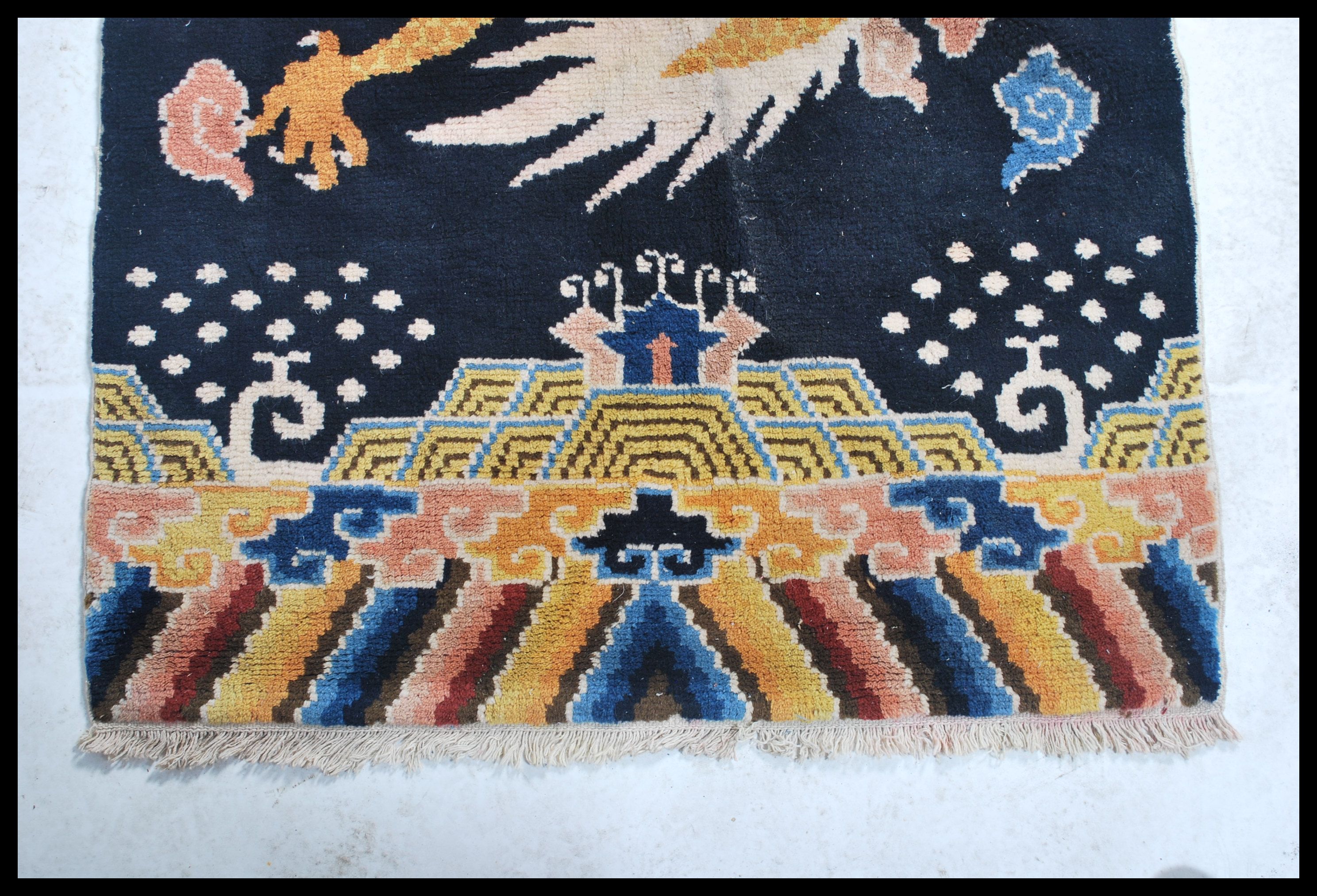 An early 20th century Tibetan dragon rug. The blue ground with large continuous dragon with - Image 3 of 6