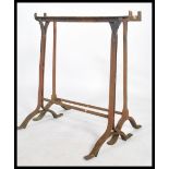 A pair of early 20th century workmens cast metal trestle ends - coffine stands ideal for
