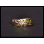 A 14ct gold white and red stone ring stamped 14k. Weighs 4.9 grams size N.5