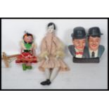 Laurel and Hardy ceramic bust, 1920s style doll with ceramic parts and puppet. Highest measures 55