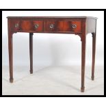A good mahogany writing table desk being raised on square tapering legs with twin fitted drawers