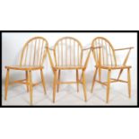 A set of 3 original mid century Ercol - CC41 utility beech wood carver dining chairs having blue