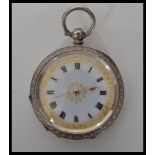 An early 20th continental silver pocket watch bearing London import silver marks. The white enamel