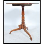 A 19th century Georgian mahogay tilt top wine / occasional side table. Raised on a tripod base