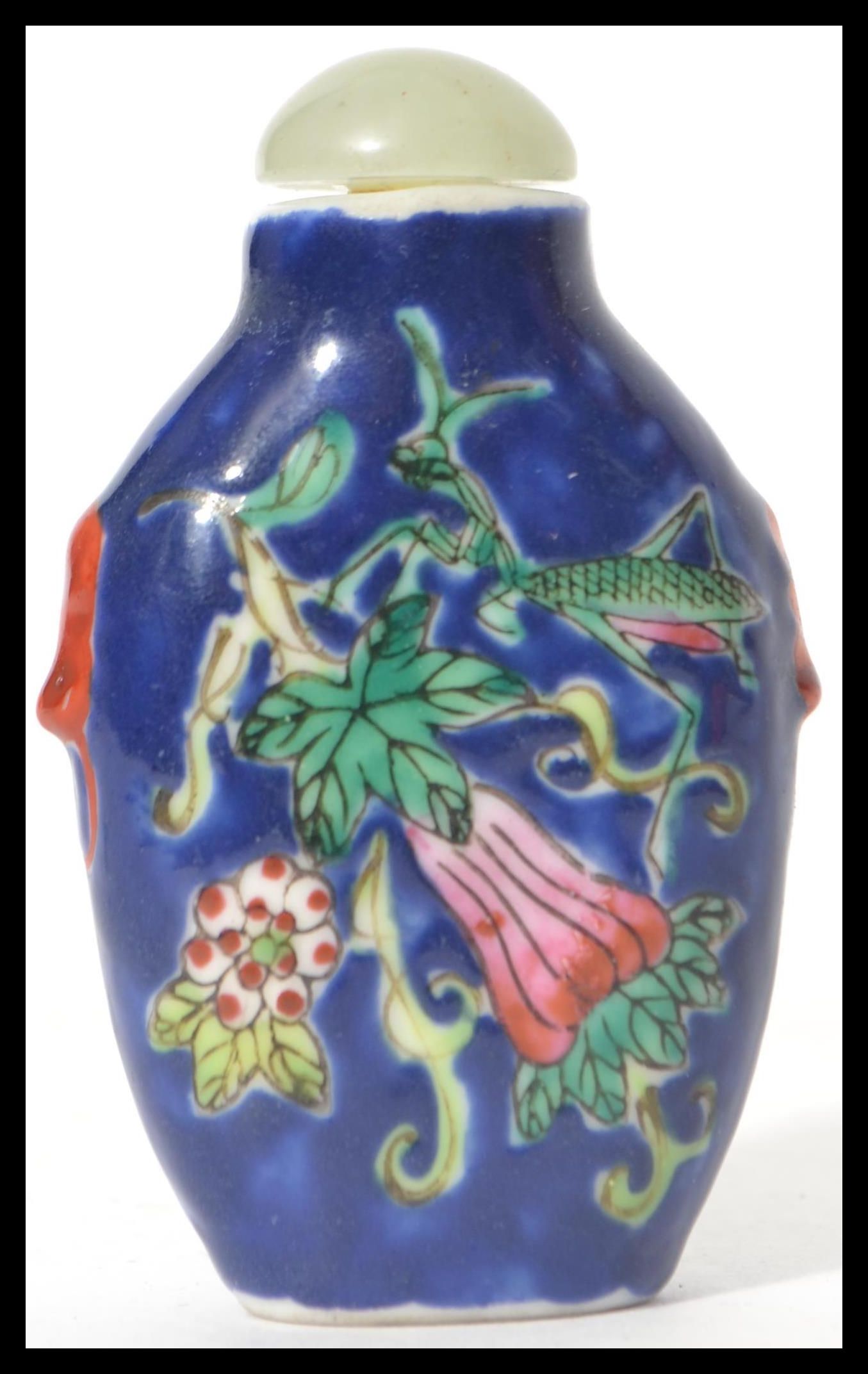 A Chinese porcelain snuff - perfume bottle with glass stopper with dabber stem. Blue ground with - Image 3 of 7