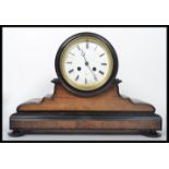 A 19th century Victorian mahogany cased mantel clock, set with an eight day movement, enamel face,