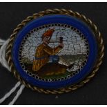 A 19th century Italian micromosaic micro mosaic and lapis lazuli brooch depicting a seated gent with