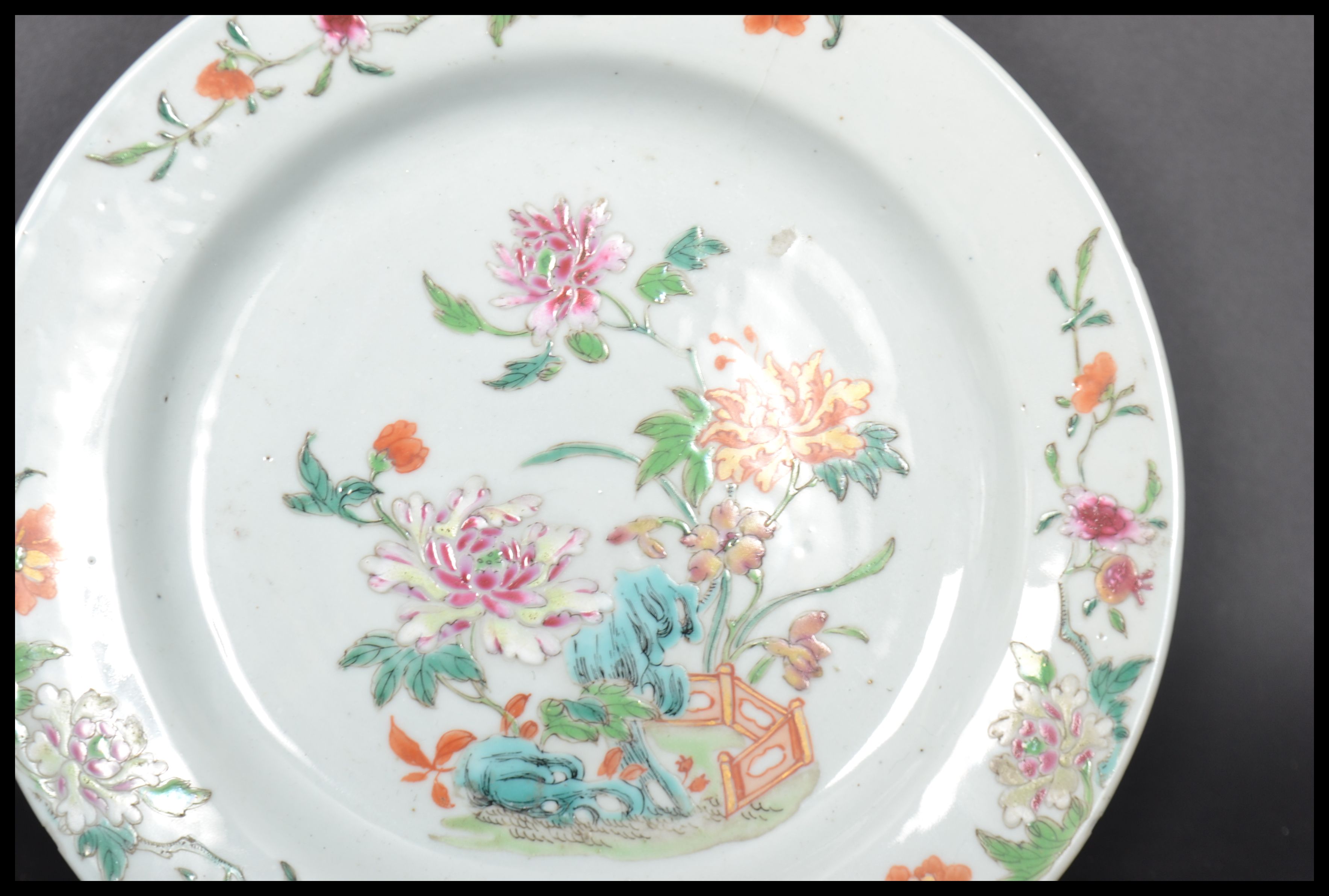 An 18th century Chinese Qing Long Famille Rose plate hand painted with enamels depicting floral - Image 2 of 8