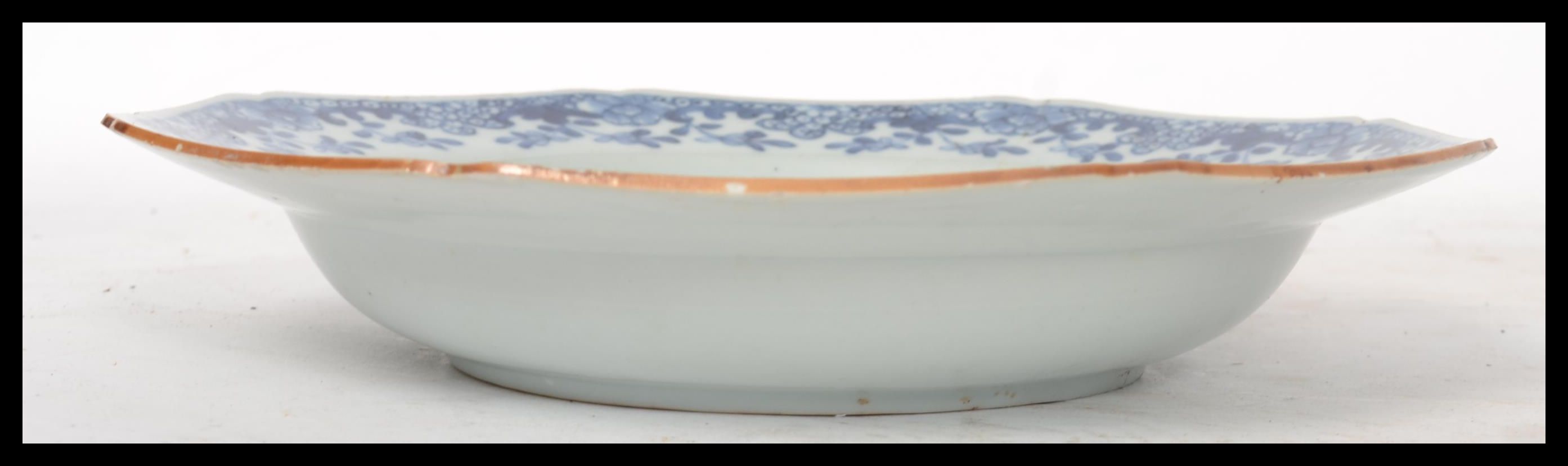 An 18th century Chinese porcelain blue and white plate, the plate decorated with domestic and - Image 2 of 4