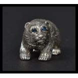 A sterling silver figure in the form of a grizzly bear. Weighs 19.3 grams.