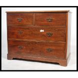 A 19th century mahogany chest of two short and two long drawers, each with brass escutcheon,