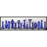 A collection of fourteen Bohemian blue glass dating from the 19th century to include ewer jugs ,